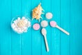 Sea Ã¢â¬â¹Ã¢â¬â¹salt in a glass white stones and Shell for spa and relaxation on a blue background Royalty Free Stock Photo